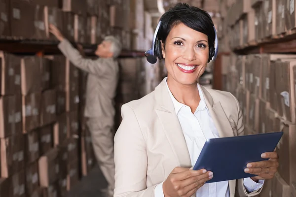 Warehouse manager using tablet pc — Stock Photo, Image