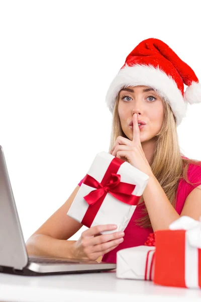 Festive blonde shopping online with laptop — Stock Photo, Image