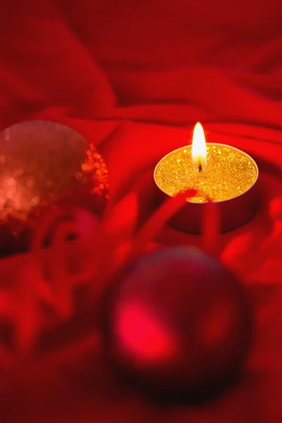 Golden tea light candle with christmas decorations — Stock Photo, Image