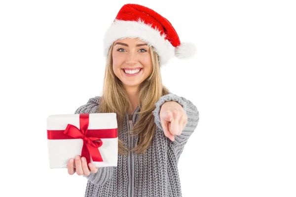 Festive blonde holding christmas gift — Stock Photo, Image