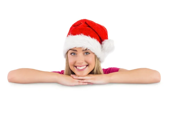 Festive blonde leaning on large poster — Stock Photo, Image