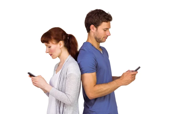Couple both sending text messages — Stock Photo, Image