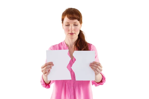 Woman holding torn sheet of paper — Stock Photo, Image