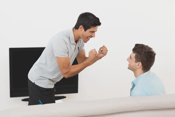 Excited soccer fans watching tv — Stock Photo, Image