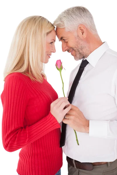 Romantic mature couple holding rose — Stock Photo, Image