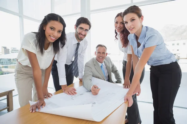 Business people smiling at camera — Stock Photo, Image