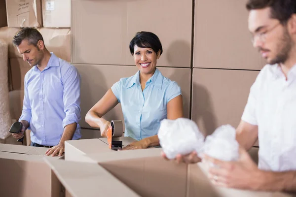 Warehouse workers preparing shipment in — Stock Photo, Image