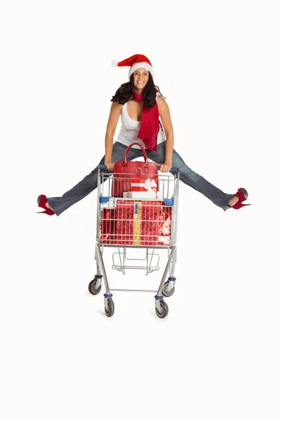 Mulher pulando com carrinho de compras — Fotografia de Stock