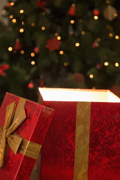 Light shining from christmas present — Stock Photo, Image