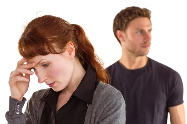 Worried woman with man behind — Stock Photo, Image