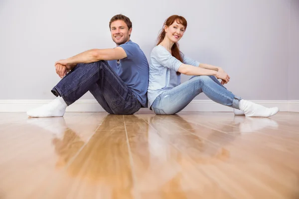 Couple both sitting on floor — Stock Photo, Image