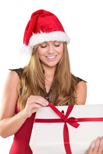 Festive blonde opening a gift — Stock Photo, Image