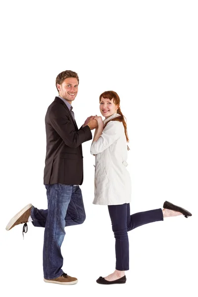 Smiling couple with raised legs — Stock Photo, Image