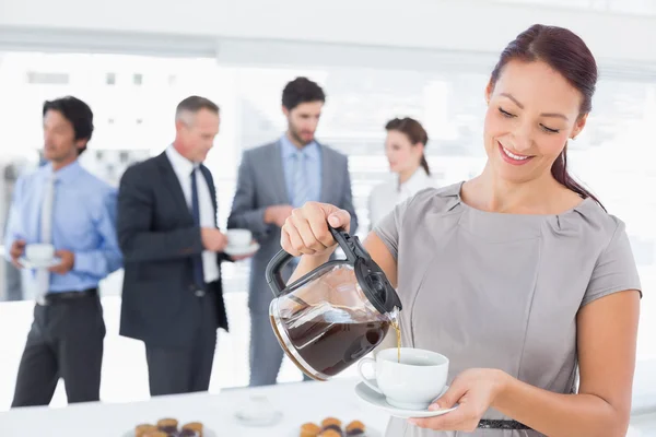 Businessman pouring himself some coffee — Stock Photo, Image