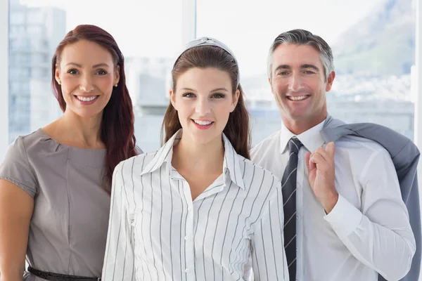 Smiling business woman with colleagues — Stock Photo, Image