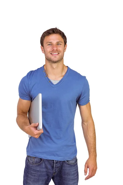 Uomo sorridente con laptop chiuso — Foto Stock