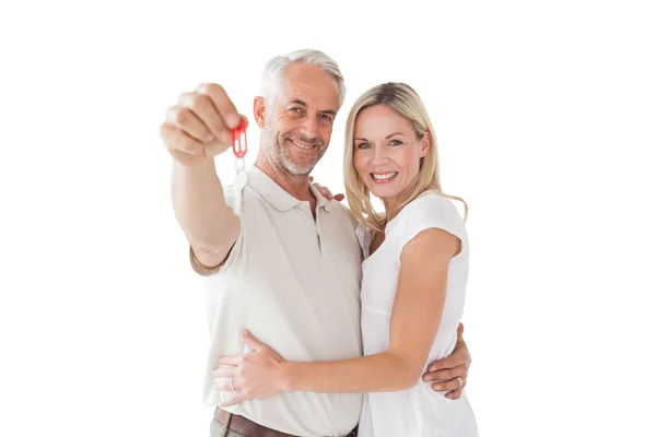 Happy mature couple holding new house key — Stock Photo, Image