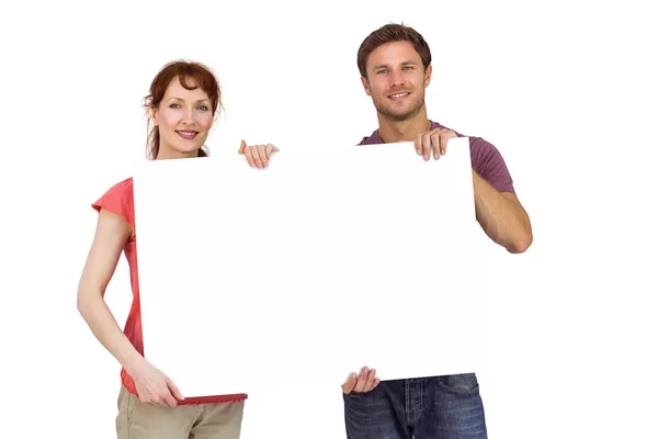 Paar mit weißem Schild — Stockfoto