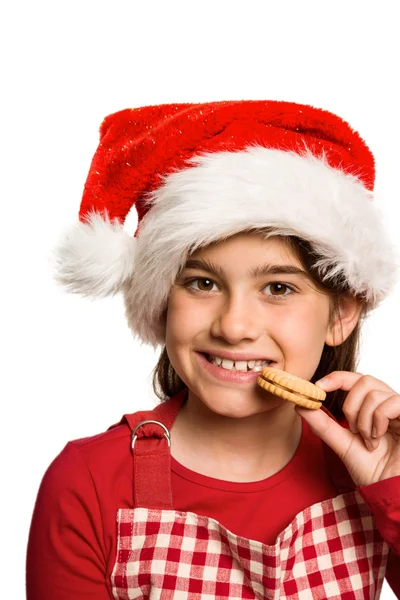 Menina festiva comer biscoito — Fotografia de Stock