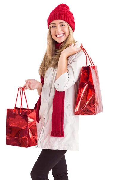 Pretty blonde holding shopping bags — Stock Photo, Image