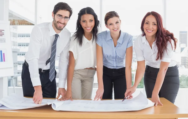 Business team smiling at camera — Stock Photo, Image