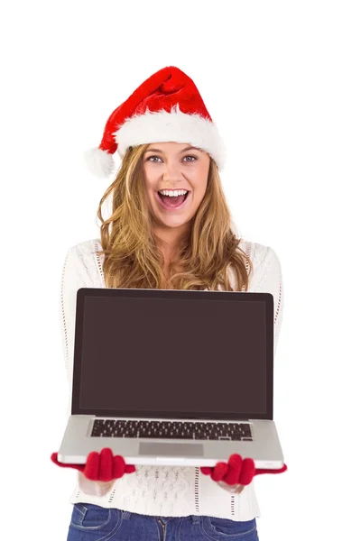 Festive blonde showing a laptop — Stock Photo, Image