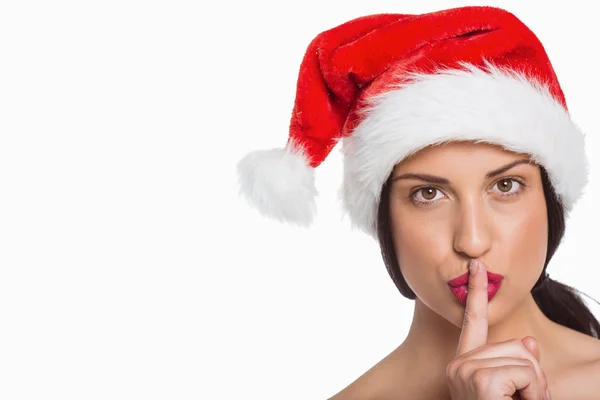 Woman with finger against lips — Stock Photo, Image