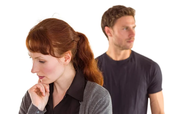 Worried woman with man behind — Stock Photo, Image