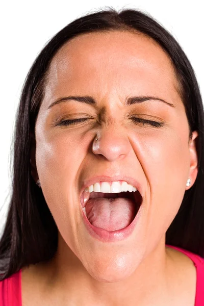 Angry young brunette shouting in close up — Stock Photo, Image