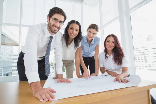 Business team smiling at camera — Stock Photo, Image