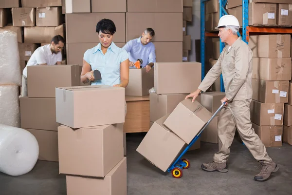 Warehouse workers preparing shipment in — Stock Photo, Image