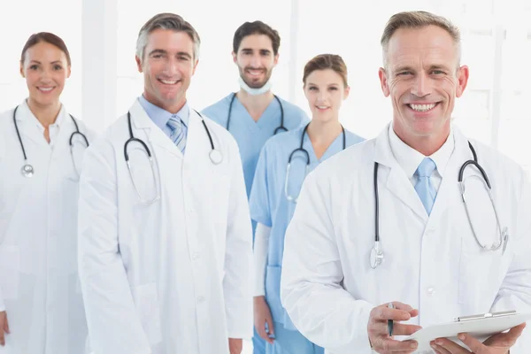 Smiling doctors all standing together — Stok fotoğraf