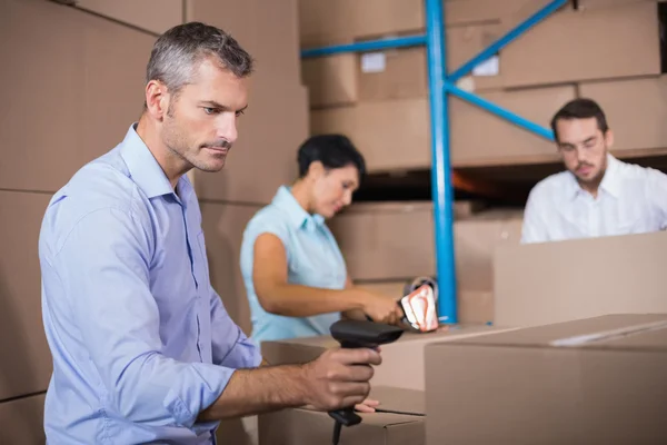 Warehouse workers preparing shipment in — Stock Photo, Image