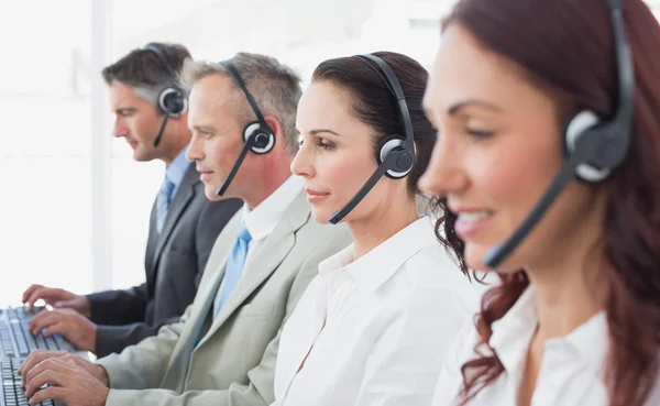 Call center workers wearing headsets — Stock Photo, Image