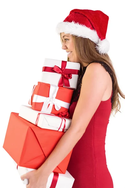 Festive blonde holding pile of gifts Royalty Free Stock Photos