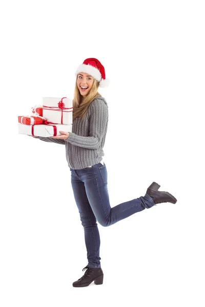 Festive blonde holding pile of gifts Stock Image