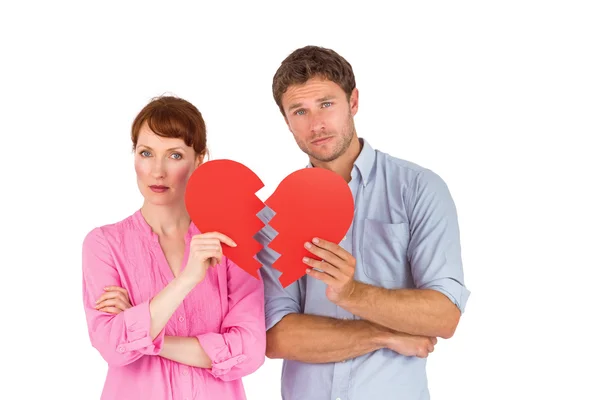 Paar houden een gebroken hart Stockfoto