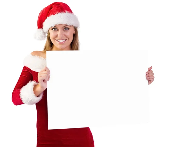 Festive blonde smiling at camera holding poster — Stock Photo, Image