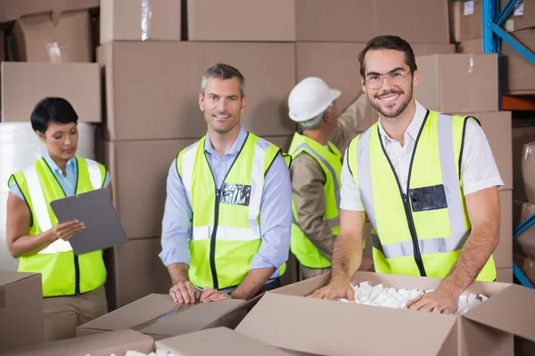 Warehouse workers preparing shipment in — Stock Photo, Image