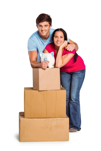 Young couple with moving boxes — Stock Photo, Image