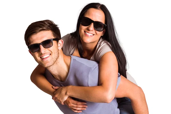 Man giving his pretty girlfriend a piggy back — Stock Photo, Image