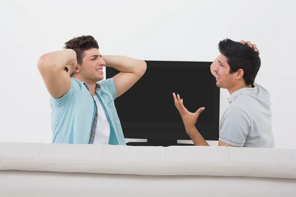 Disappointed soccer fans watching tv — Stock Photo, Image