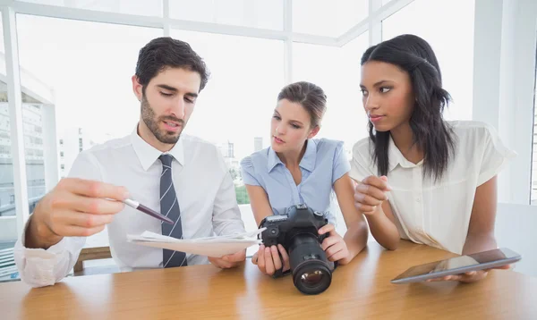 Business people using a camera — Stock Photo, Image