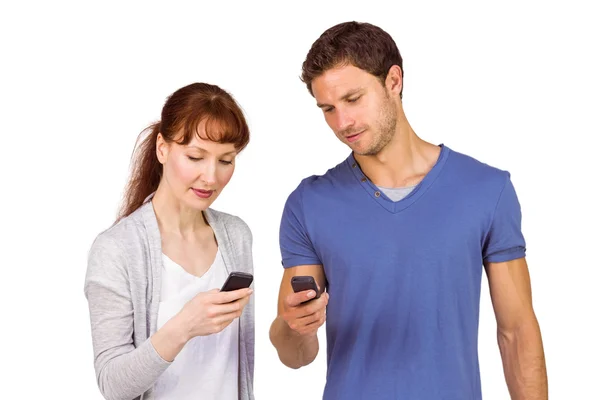 Couple using their mobile phones — Stock Photo, Image