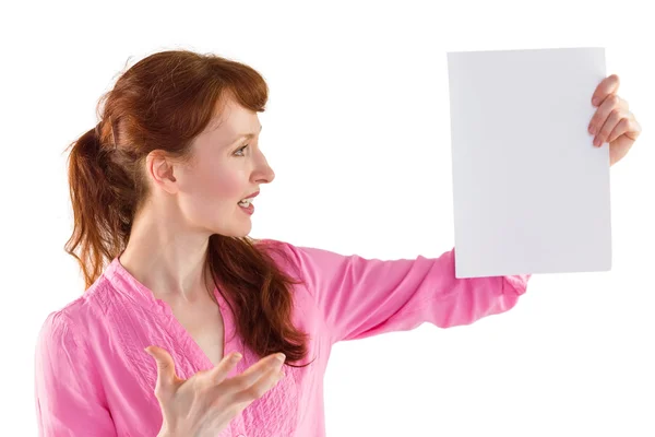 Surprised woman looking at paper — Stock Photo, Image