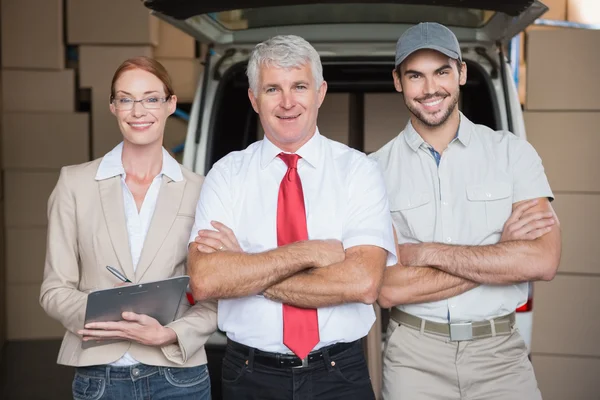 Warehouse managers and delivery driver smiling — Stock Photo, Image