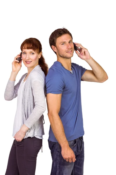 Couple both making phone calls — Stock Photo, Image