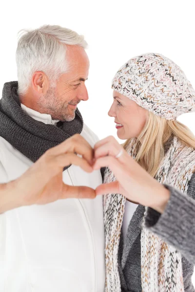 Mature couple forming heart with hands — Stock Photo, Image