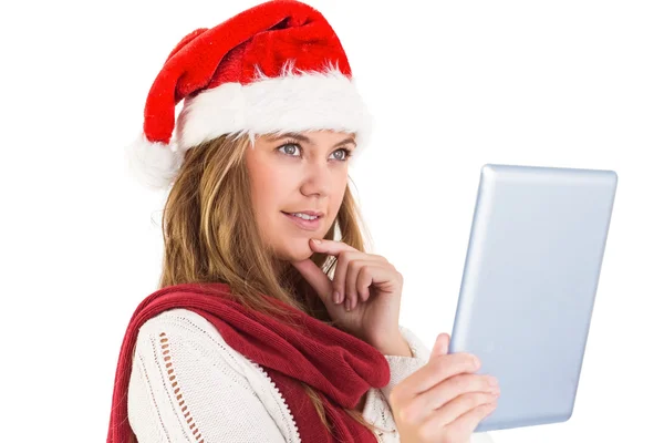 Feestelijke blonde kijken naar tablet pc — Stockfoto