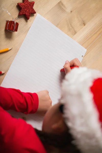 Little girl writing letter to santa at christmas — Stock Photo, Image